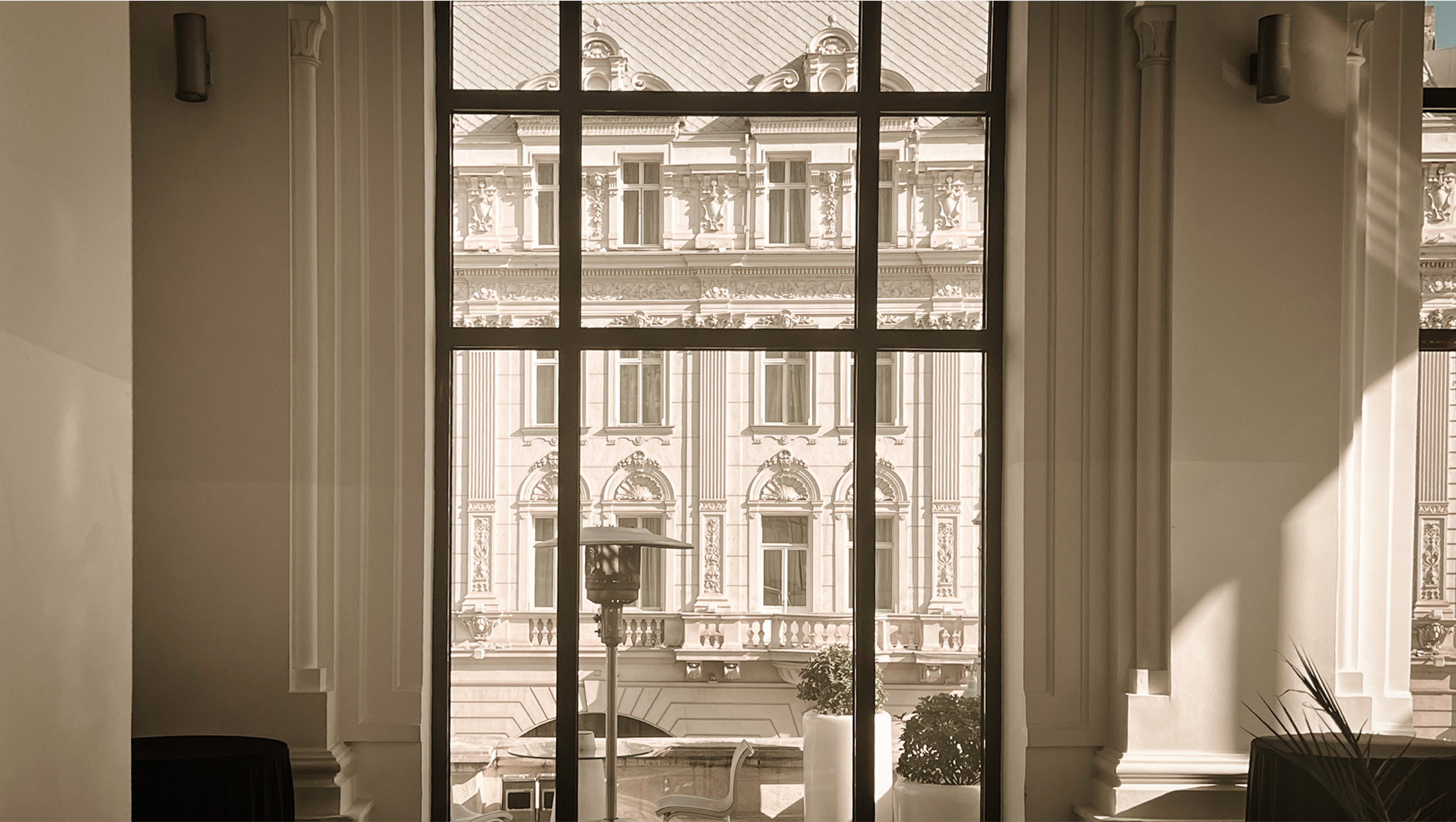 Historic facade seen through a sunlit interior window