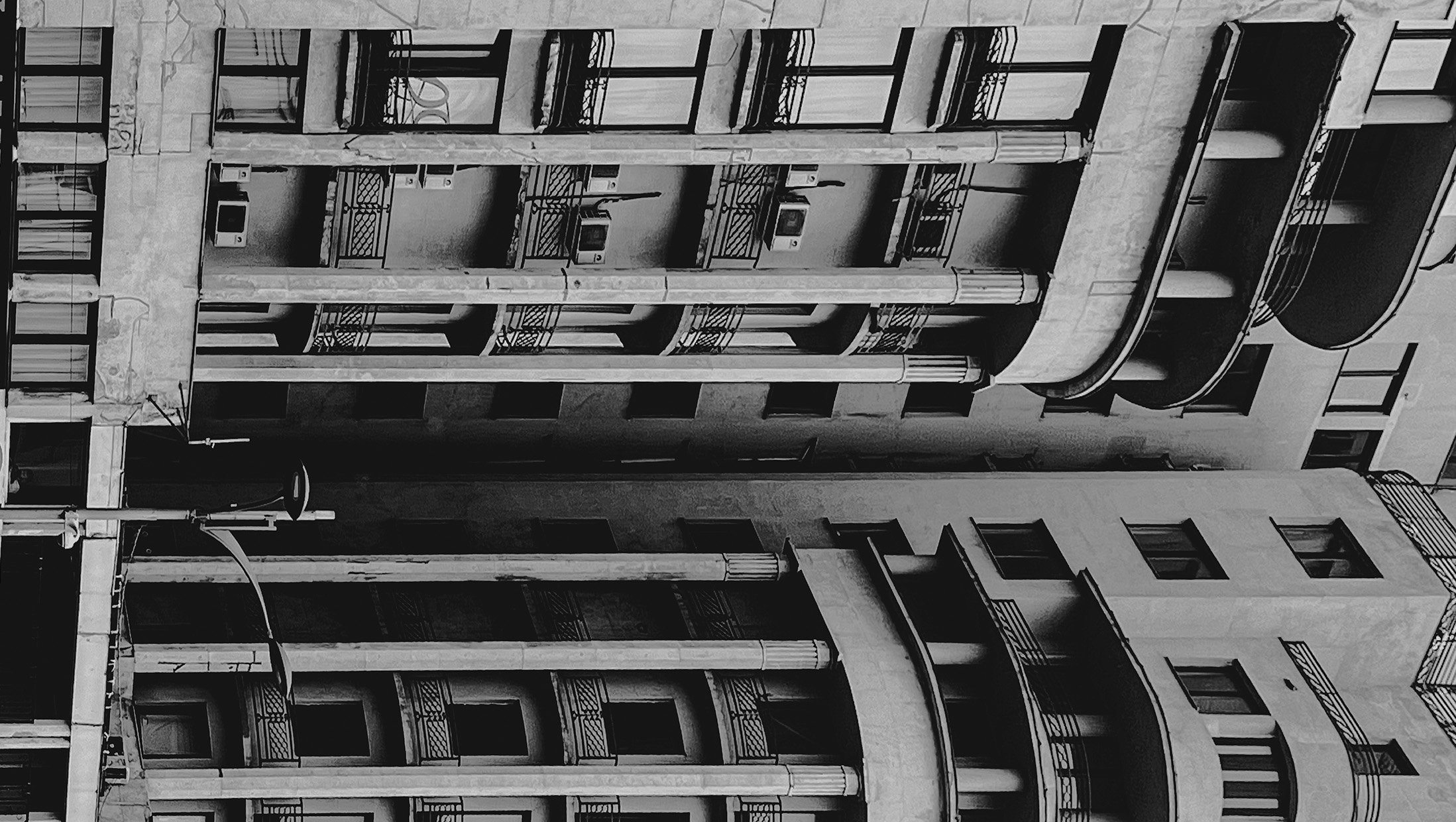 Black-and-white view between apartment facades